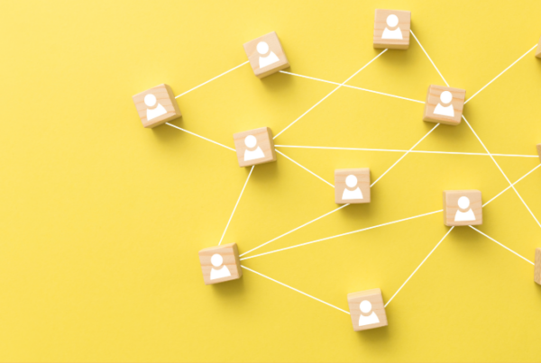 yellow background with people blocks joined together by string