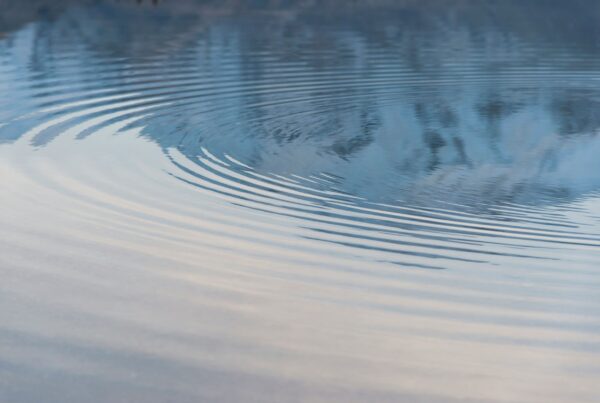 Abstract ripple symbolising reflection and intentional leadership response.